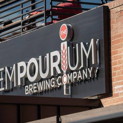 The Empourium Brewing Company sign.