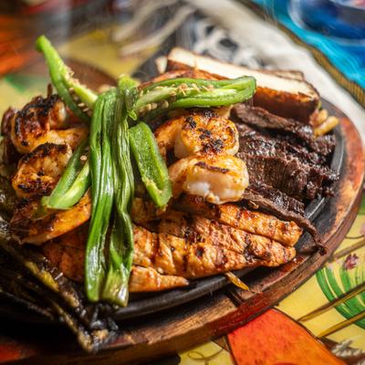 Fajitas a la Mexicana with chicken, skirt steak, shrimp, cactus and chorizo.