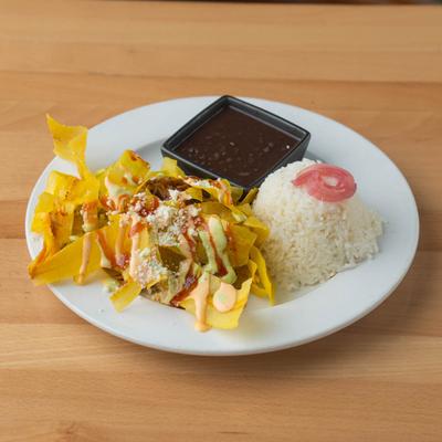 Grilled chicken served over jasmine rice with fried plantains, rice and black beans.
