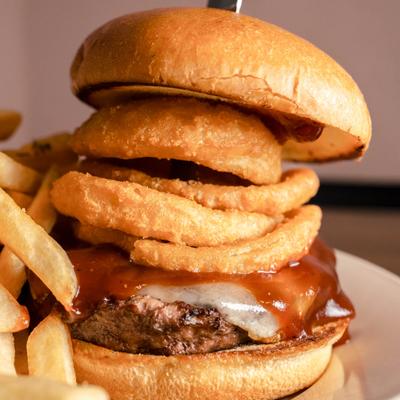 BBQ cheeseburger with onion rings.