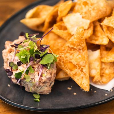 Spicy Tuna Tartar served with tortilla chips, closeup.