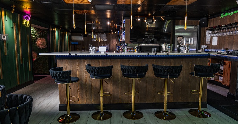 Bar with upholstered stools