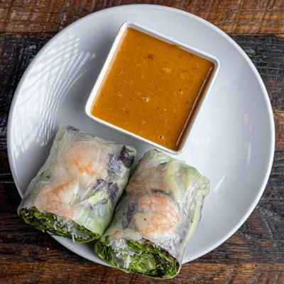 Tiger Prawn Roll served with a peanut sauce on the side.