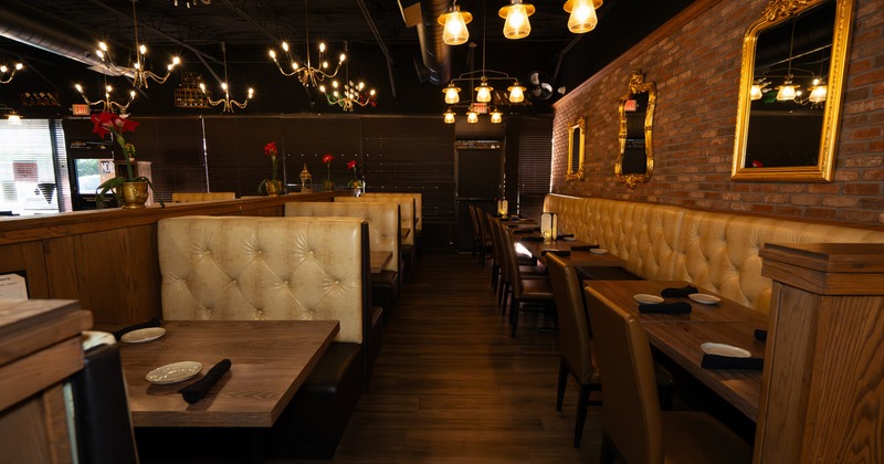 Interior, dining area with wooden tables and leather benches