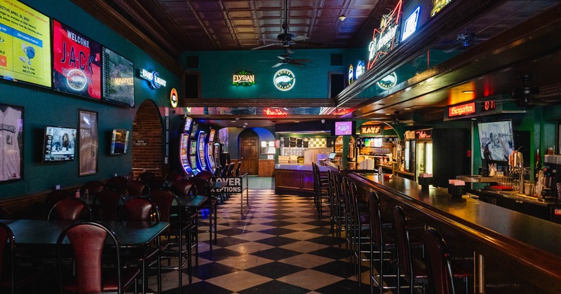 Interior, seating area with a bar on the right
