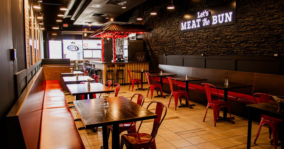 Interior with tables, chairs, and a bar