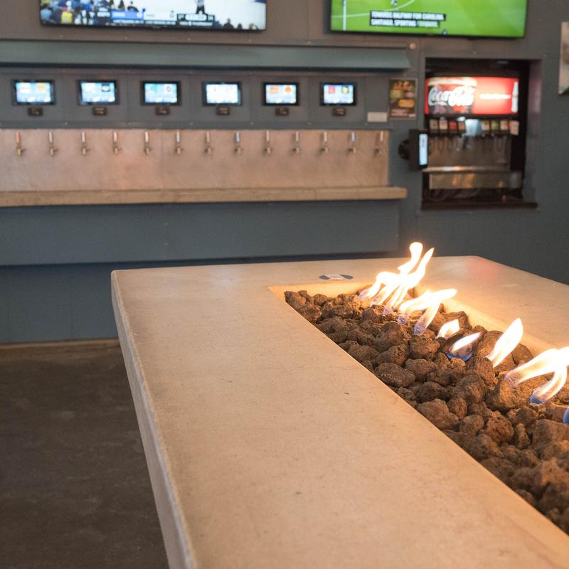 Interior, firepit table and beer taps behind