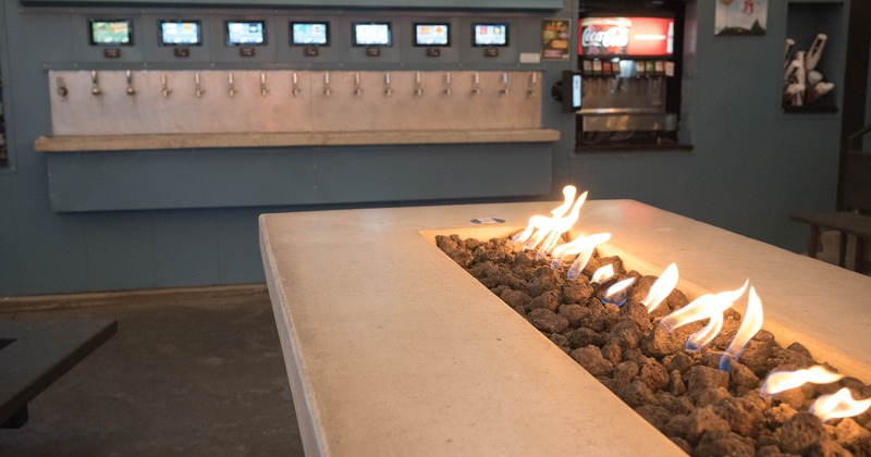 Interior, firepit table and beer taps behind