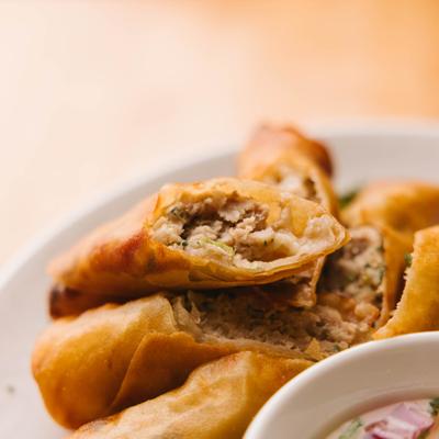 Crispy spring rolls with dipping sauce.