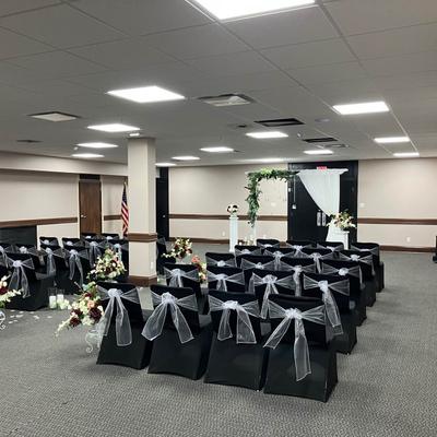 A large event hall prepared for a celebration.