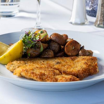 Served schnitzel in the plate.