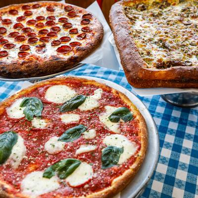 Margherita pizza, Sicilian pizza, and Pepperoni pizza displayed on a blue checkered table.
