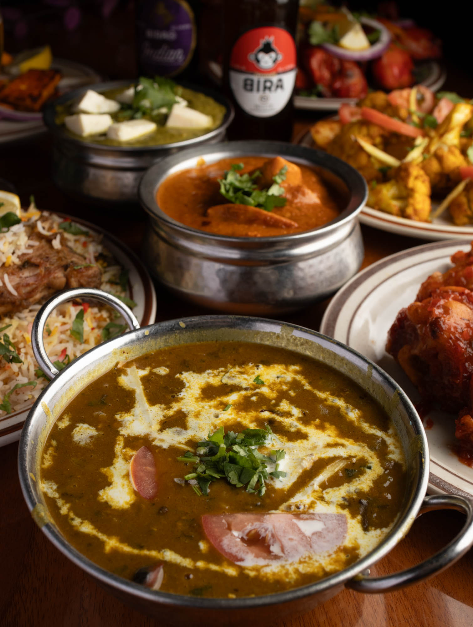 Curry Lentil Soup surrounded by various traditional dishes