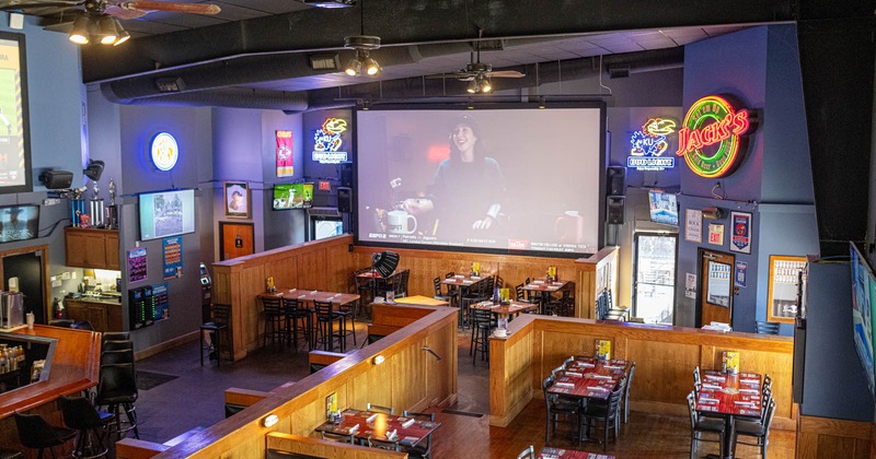 Interior, wide view of dining area, tables and chairs ready for guests