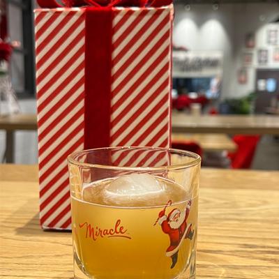 A drink and a wrapped gift