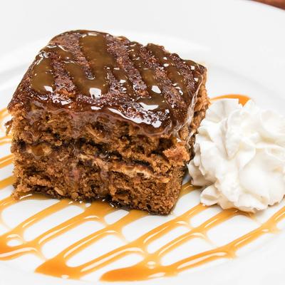 Cake, with caramel drizzle, and whipped cream.