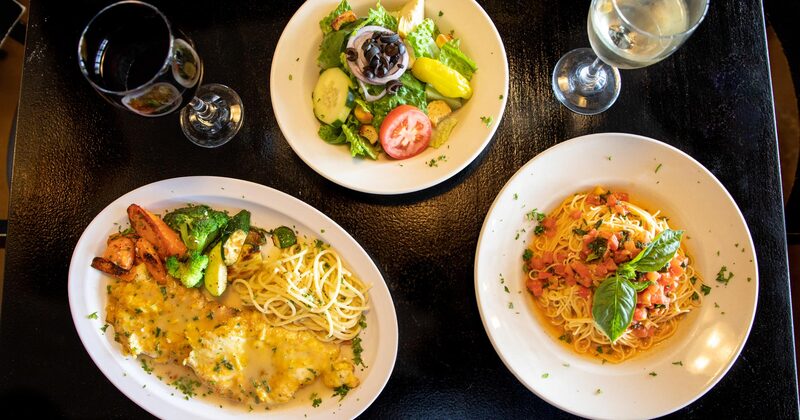 Multiple dish plates and wine, top view