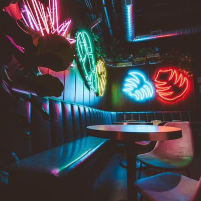Seating area lit by neon lights