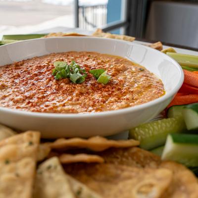 Hummus with veggies and crackers.