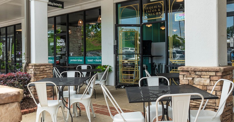 Outdoor seating area in front of the restaurant's entrance