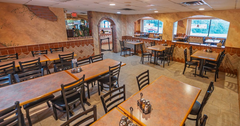Interior, tables and chairs ready for guests