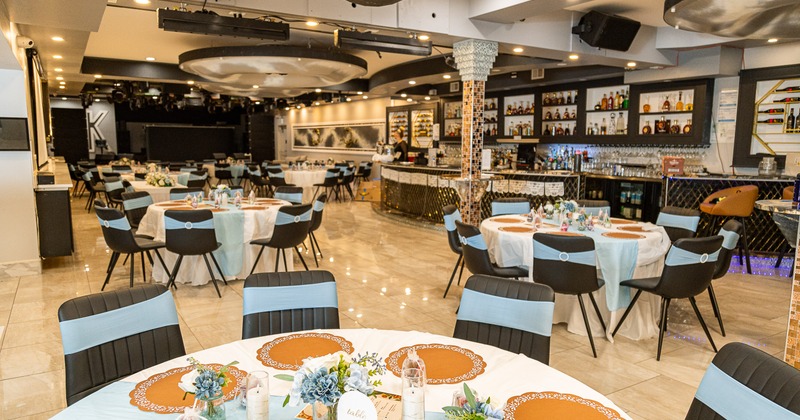 A luxurious and spacious banquet hall with modern, elegant design and sophisticated event decor