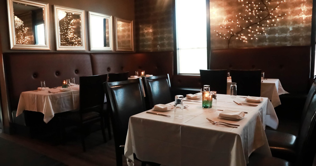 Inside, seating area with tables and chairs
