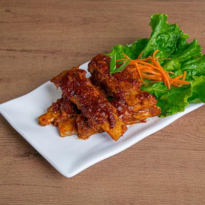 Stir fried pork ribs, covered in chili garlic sauce.