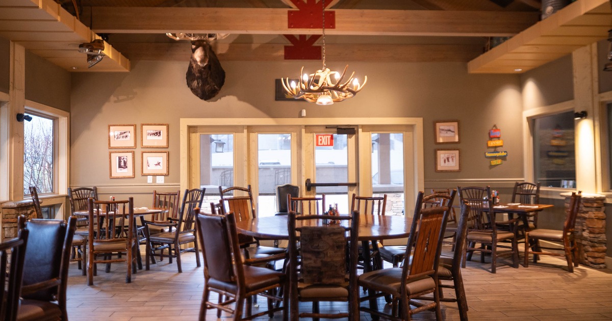 Interior, tables and chairs in dining area