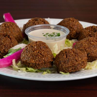 Falafels served with a sauce.
