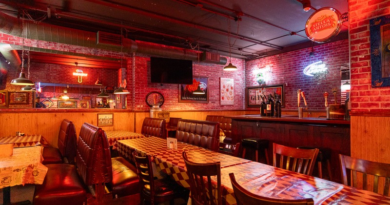 Spacious dining area with comfortable upholstered seats and wooden tables and chairs