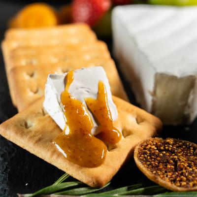 Brie cheese with crackers and dried figs.
