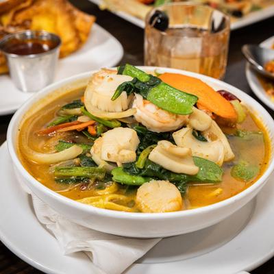 Spicy Seafood Noodle Soup with scallops, shrimp, calamari and vegetables.