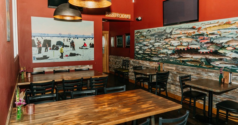 Dining area with red walls and fish mural