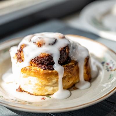 Cinnamon roll with white icing.