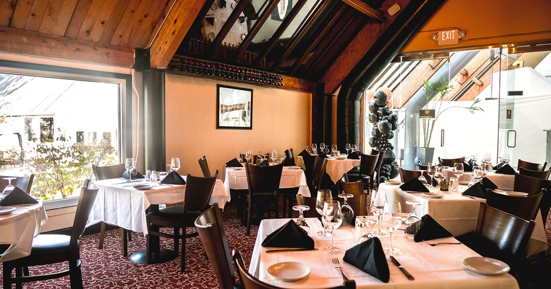 Interior, tables set for dining