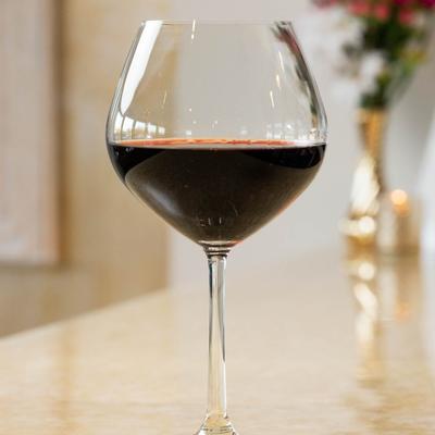 A glass of red wine.