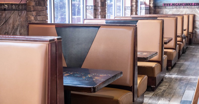 Interior, seating booths with wooden top tables