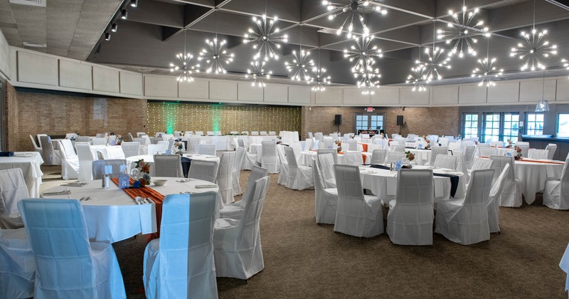 Banquet tables and chairs covered with white cloth