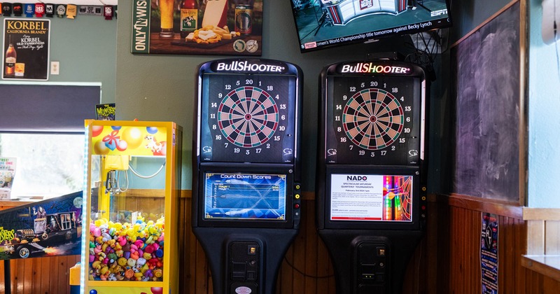 Electronic dart boards and an arcade claw machine