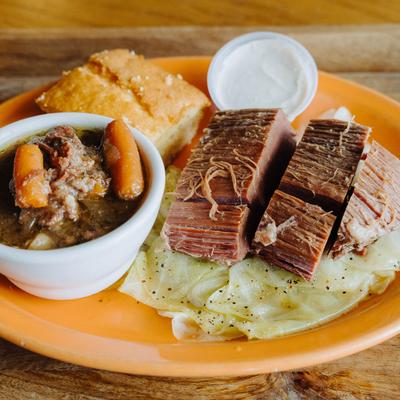 Corned Beef and Cabbage, served with cornbread, and Irish stew.