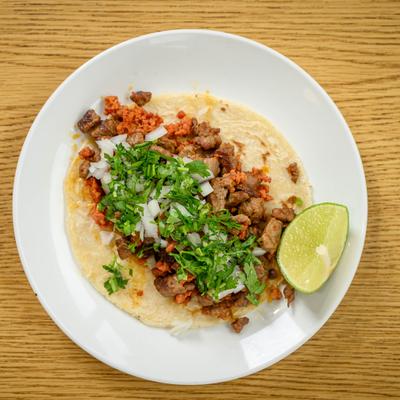 Mixed meat burrito with onion and cilantro.