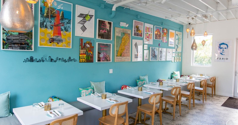 Interior, tables with tableware and chairs, long bench