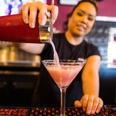 Employee making martini