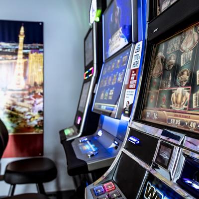 Several electronic slot machines in a gaming area of the restaurant.