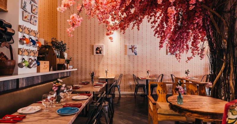 Nice decorated restaurant interior, dining area with set tables