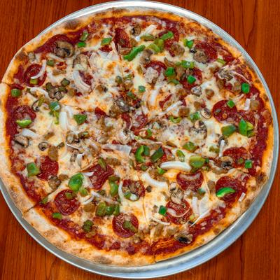 Special pizza topped with meats peppers and onions.