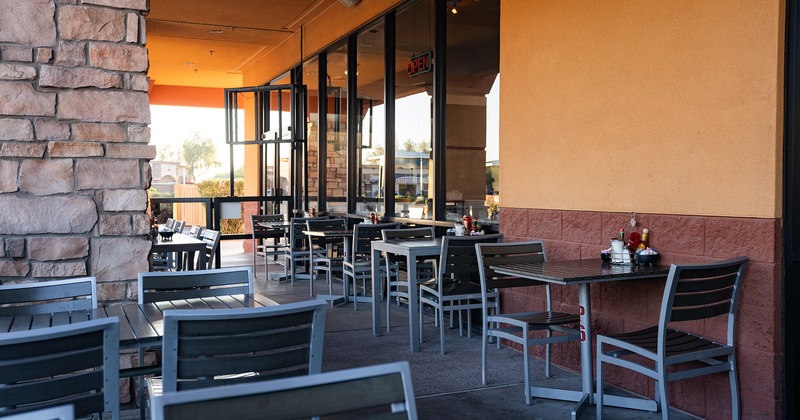 Exterior, patio with tables and chairs