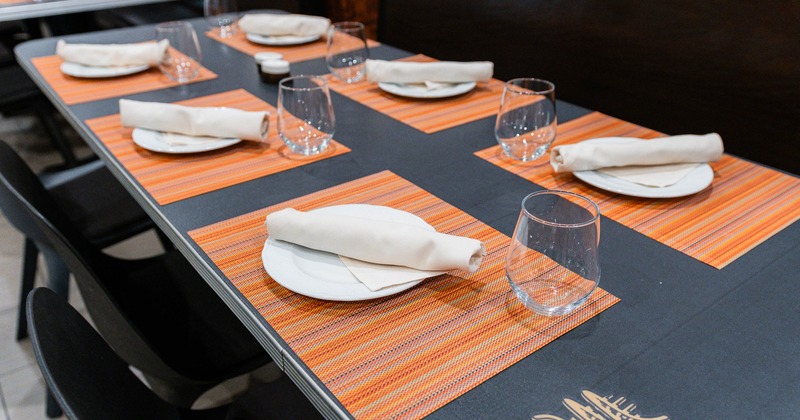 Interior, table fully set for guests