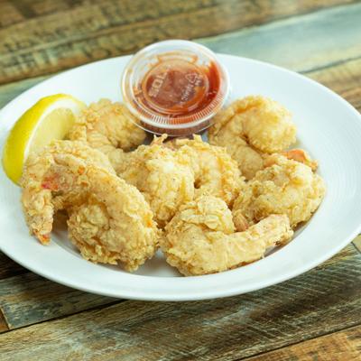 Fried shrimp basket served with lemon and dipping sauce.